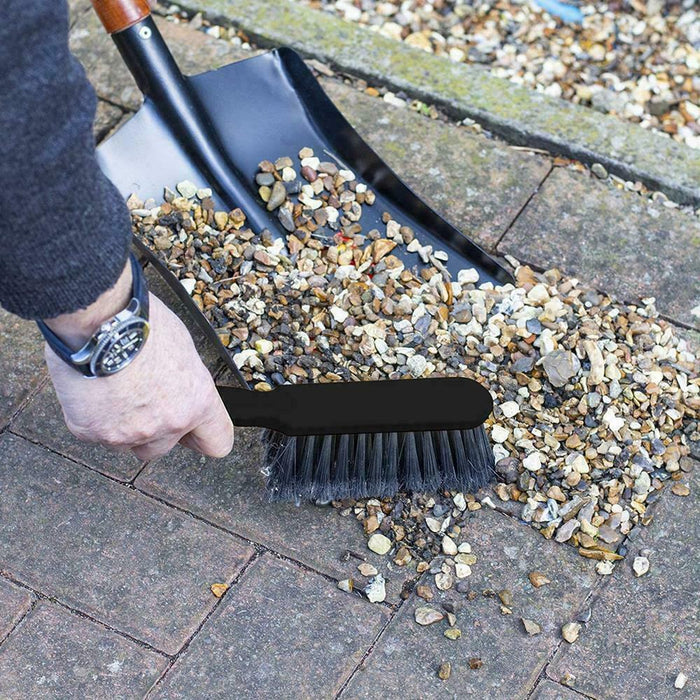 Metal shovel with easy-grip wooden handle for comfortable use