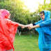  Person wearing the poncho while camping and hiking, emphasizing its practicality